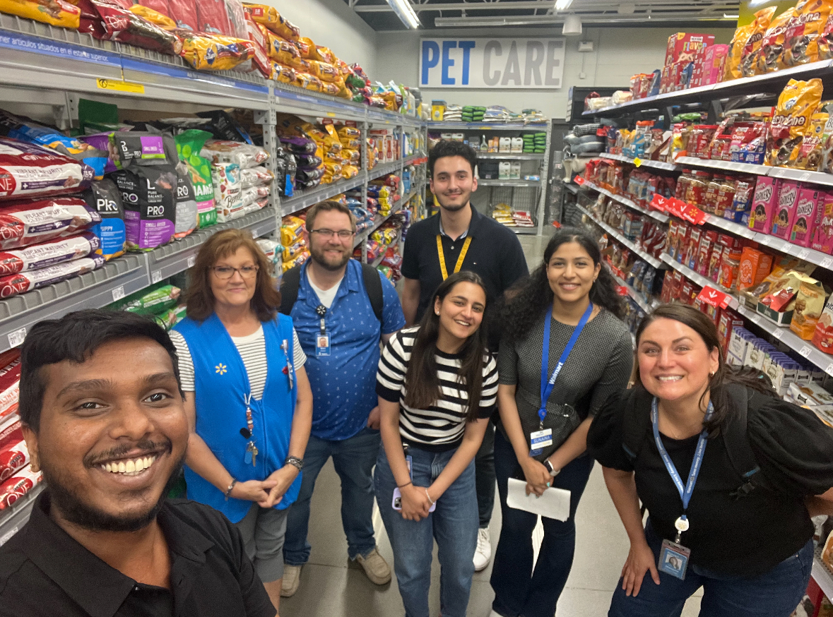Preet and colleagues visiting a Walmart store